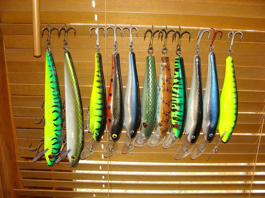 A box of large musky lures, the hardware a sucker fisherman carries alongside.