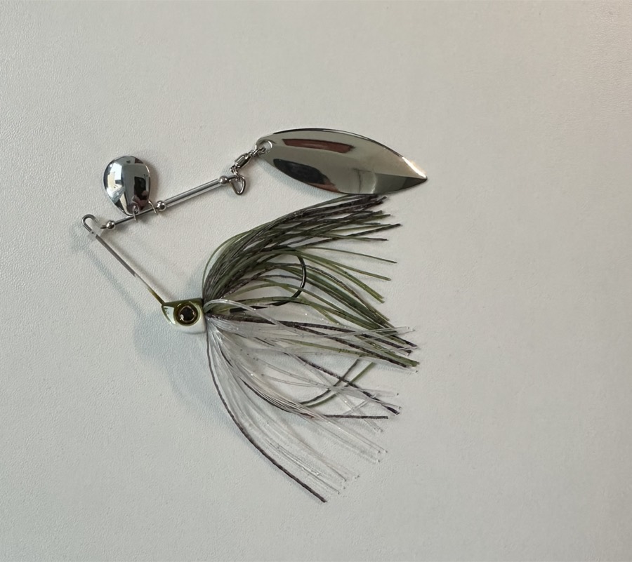 A safety-pin spinnerbait with a metal blade and a rubber skirt.